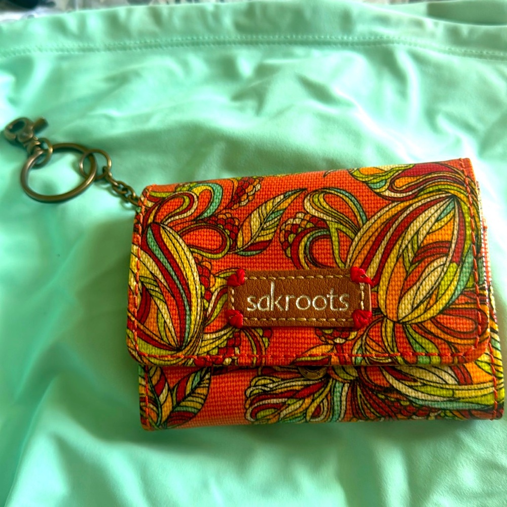 Sakroots trifold wallet. Used. One small stain on inside. Colorful wallet.